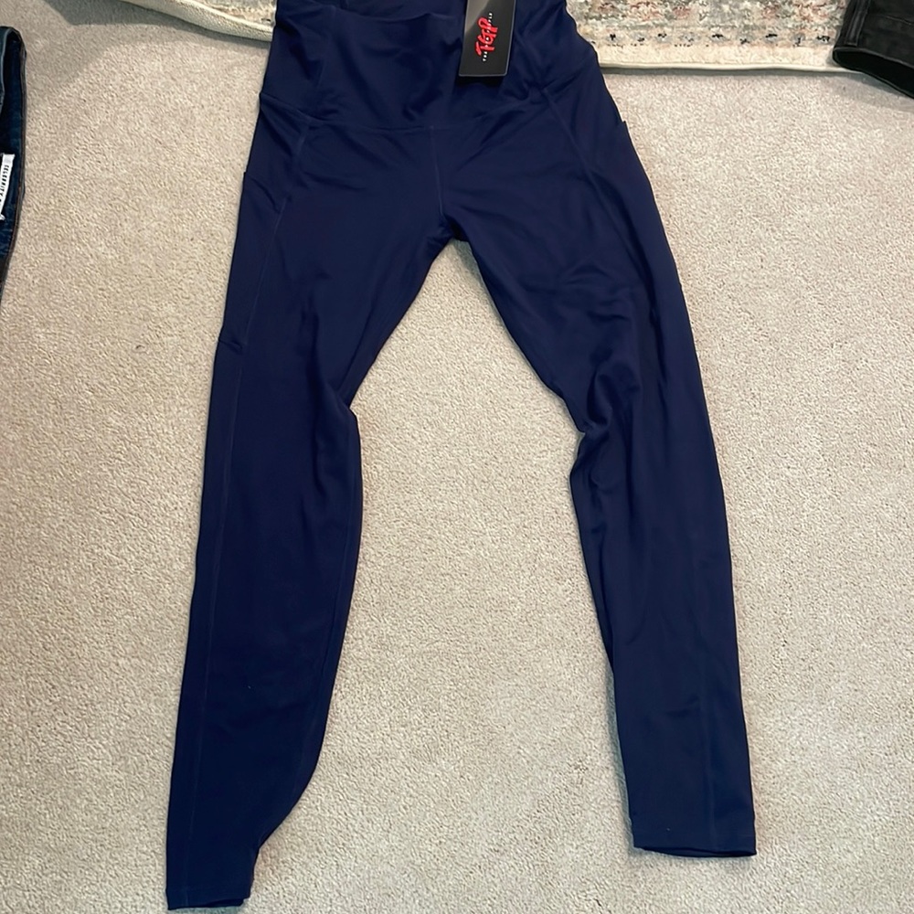 Never worn, navy blue color, size small, pockets, good quality